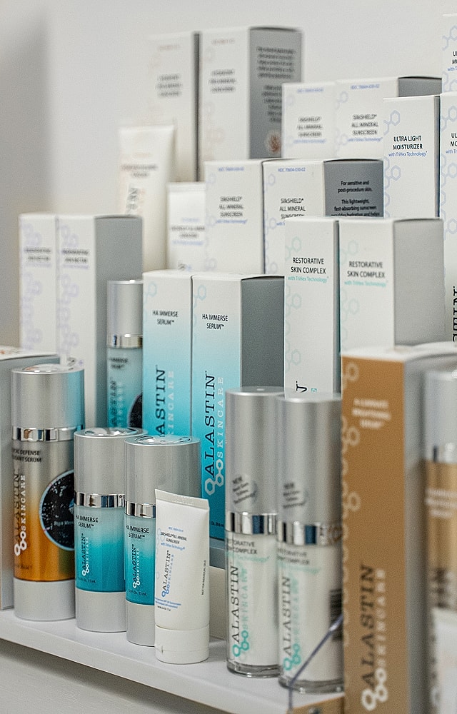 Assorted Alastin skincare products on display.