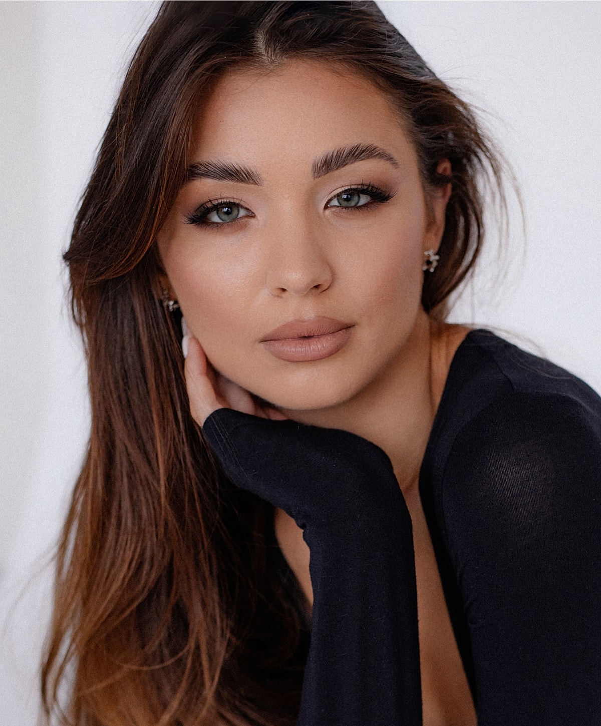 Portrait of a woman with long dark hair.