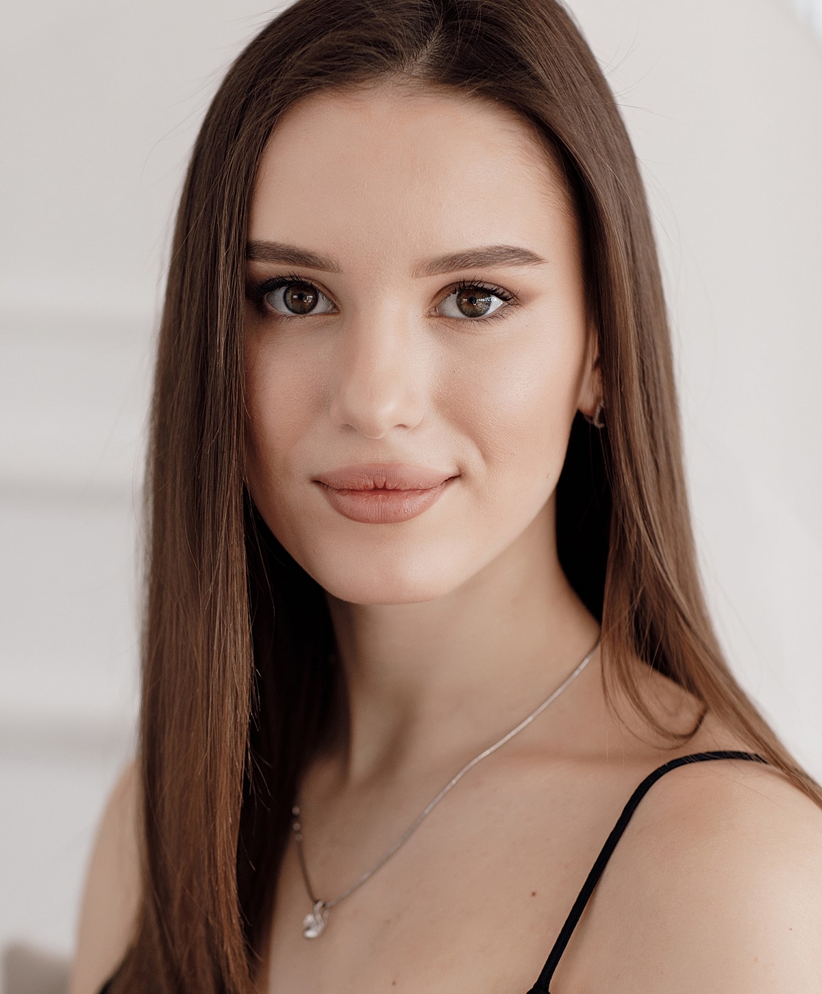 Portrait of a young woman with long hair.