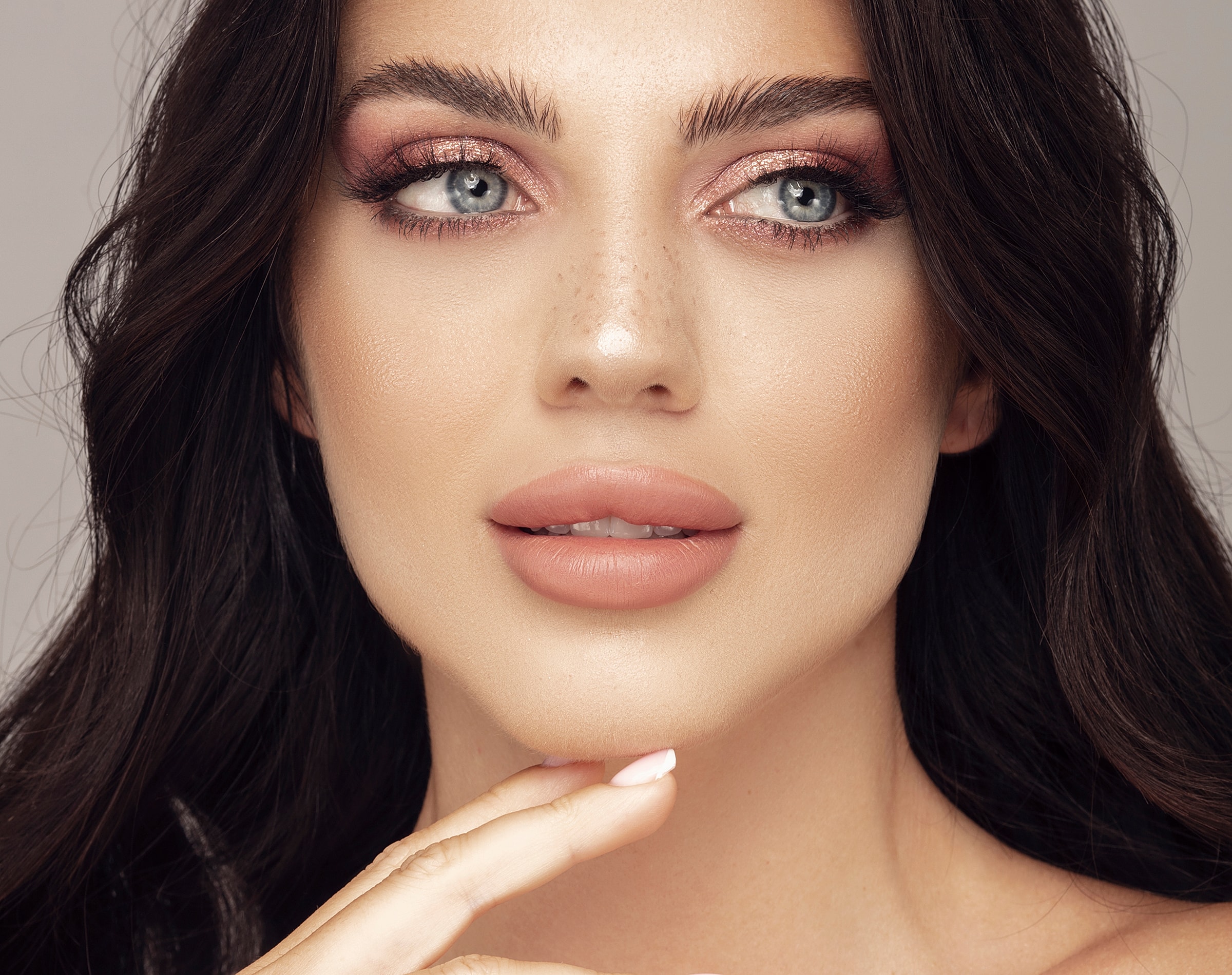 Close-up of a woman with soft makeup.