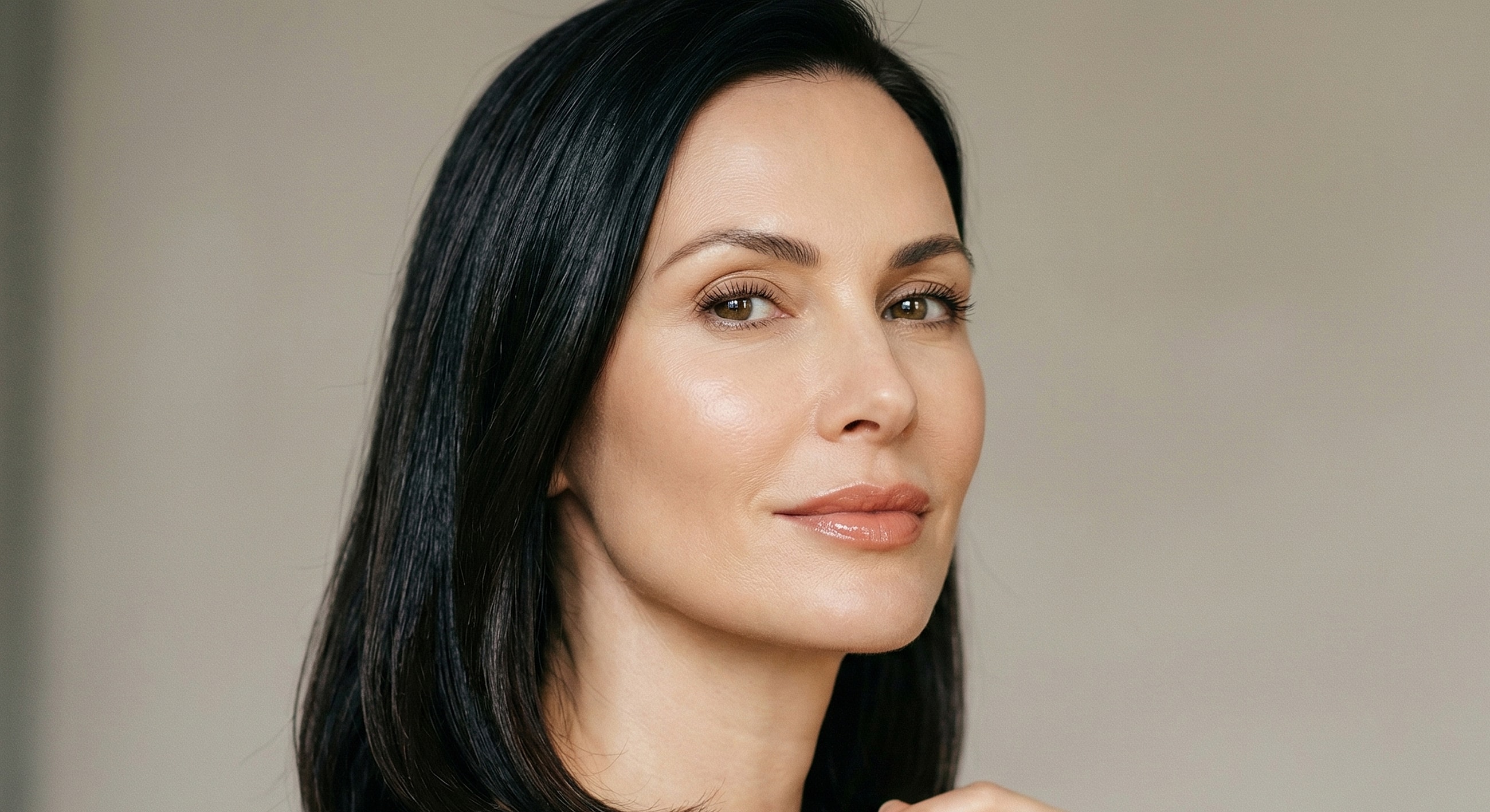 Woman with smooth skin and dark hair.