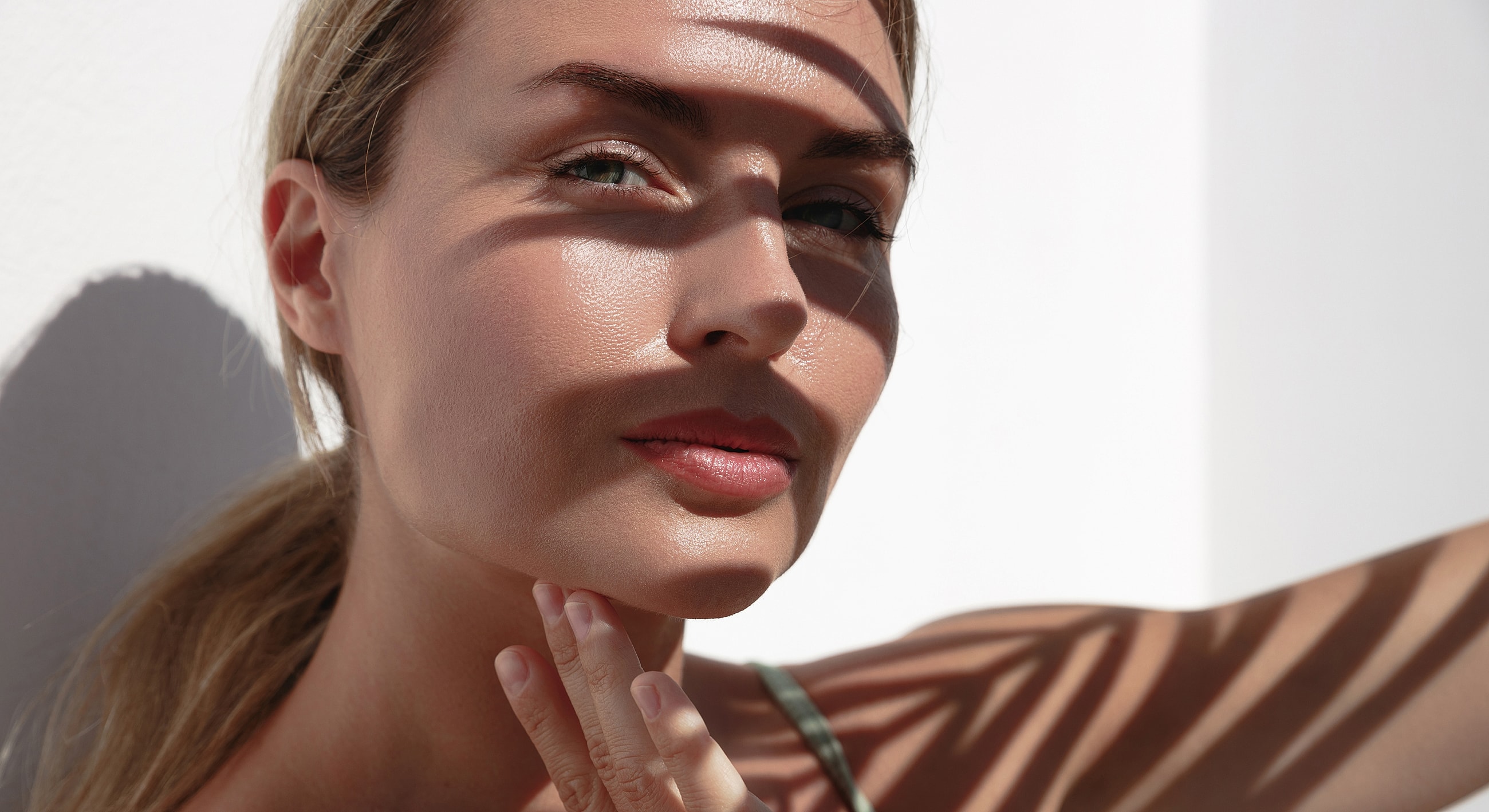 Close-up of woman in shadow and light.